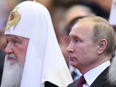 Патриарх Кирилл и Владимир Путин. Фото: "Известия"